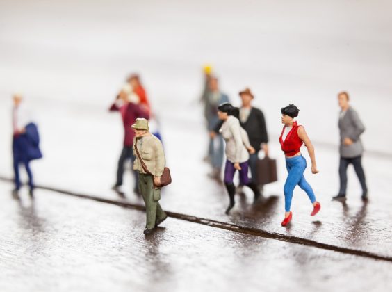 Conceptual image of miniature people travelling